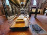 How many reflections of this sarcophagus  top can you see