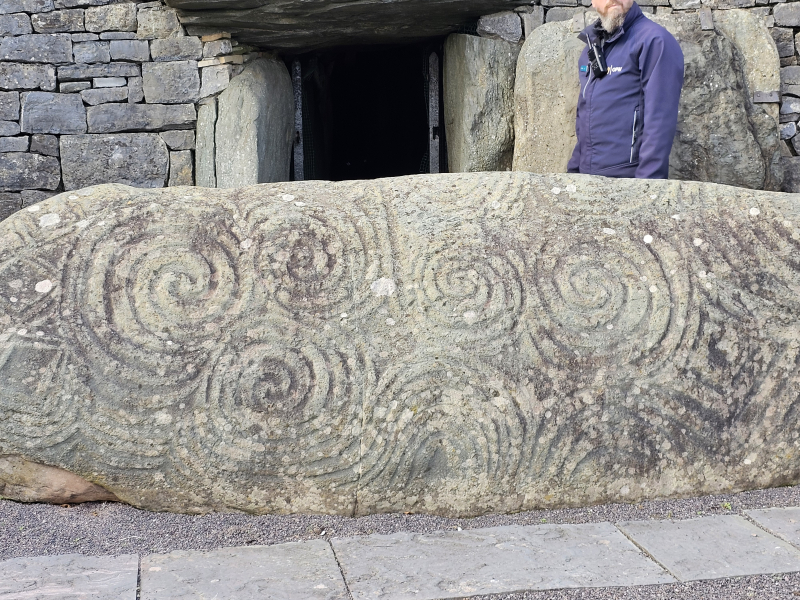 The Entrance Stone at Newgrange. The vertical line lines up with the window above the passage which lets the winter solstice light into the inner chamber.