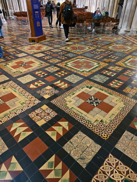 The tile floor was paid for, along with much of the restoration in the 1870s, by a member of the Guinness family.