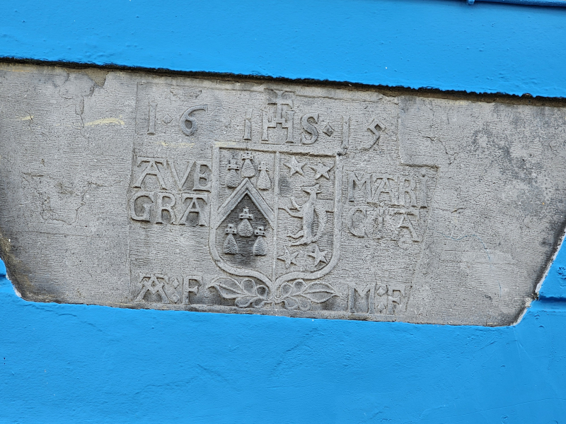 Marriage stone above door of Gallway house. Used to announce a Catholic marriage between two families.