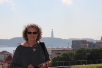 Patricia in the museum with huge statue of Christo Rei (Christ the King) in the background across the Tagus