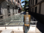 Clever: This mannequin/ sculpture is observing ancient ruins below street level.