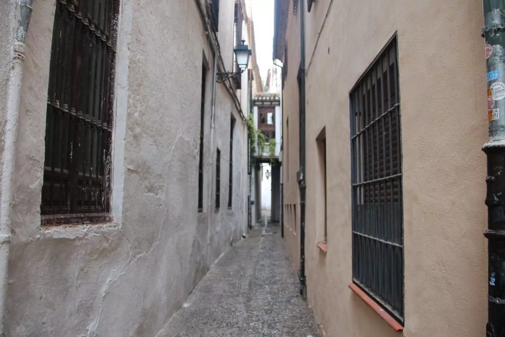 Would you go down this street to find a hotel?