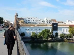 Walking across the Triana Bridge