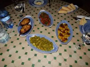 Four kinds of salad: okra, stuffed aubergine, sweet potato and raisin, and roasted pepper.